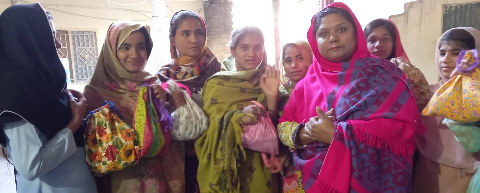 group of women carrying DFG kit